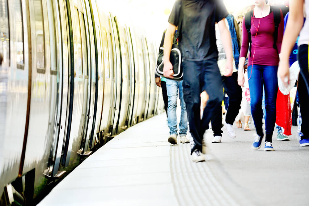 people walking on a subway platform
