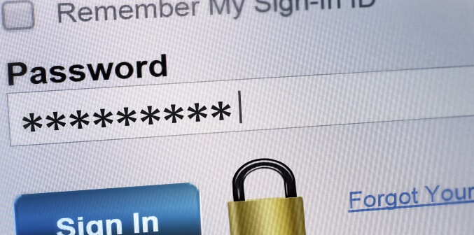 person entering password on a screen